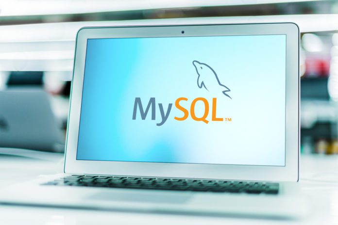 MySQL logo on a laptop.